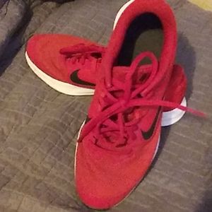 Red Nike shoes. Size 6.5y equal to womans 7
